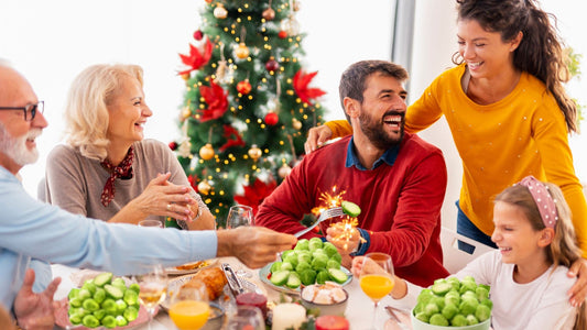 family around a table celebrating Christmas