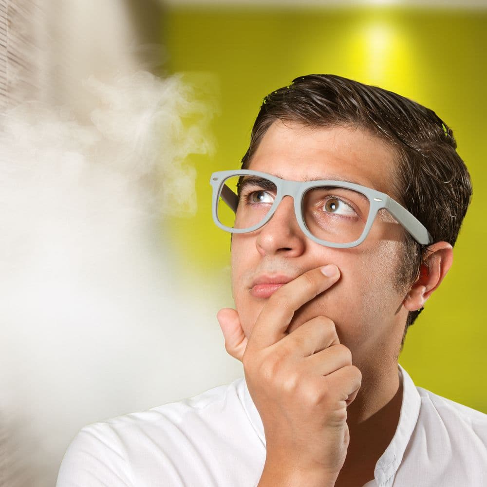 man looking pensive with steam coming from the side of the image