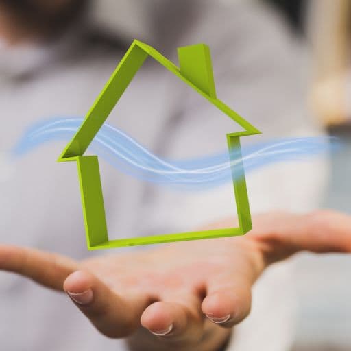 outline graphic of a house with airflow sitting in the palm of a hand