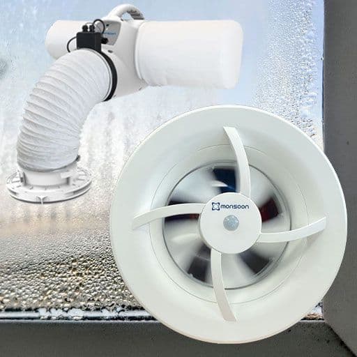 condensated window with an insert of two extractor fans