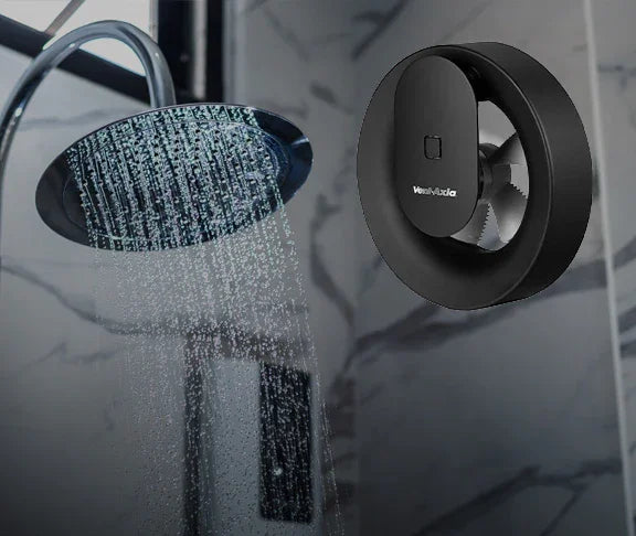 Black shower head and nozzle with water droplets on a reflective surface
